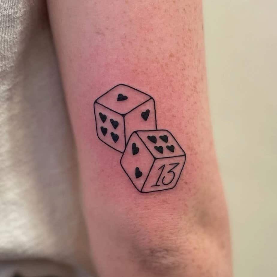 14. Dice tattoo on the back of the arm