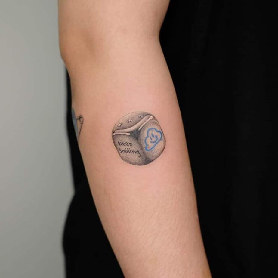 18. Dice tattoo with a message