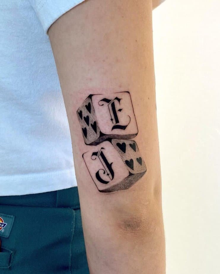 20. Dice tattoo with letters