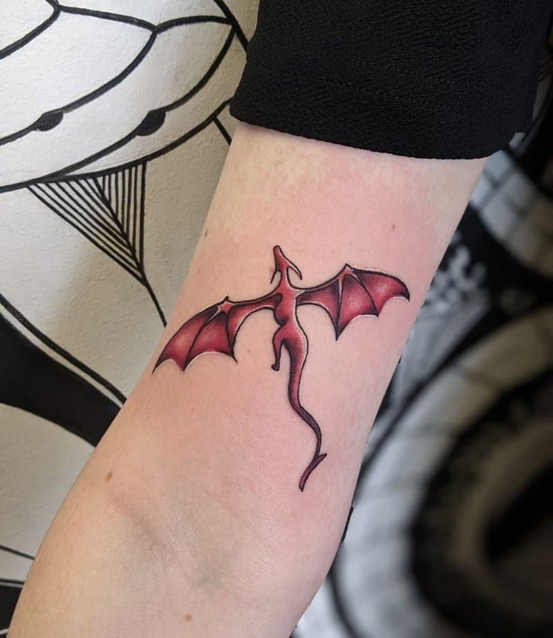 4. A mini red dragon tattoo