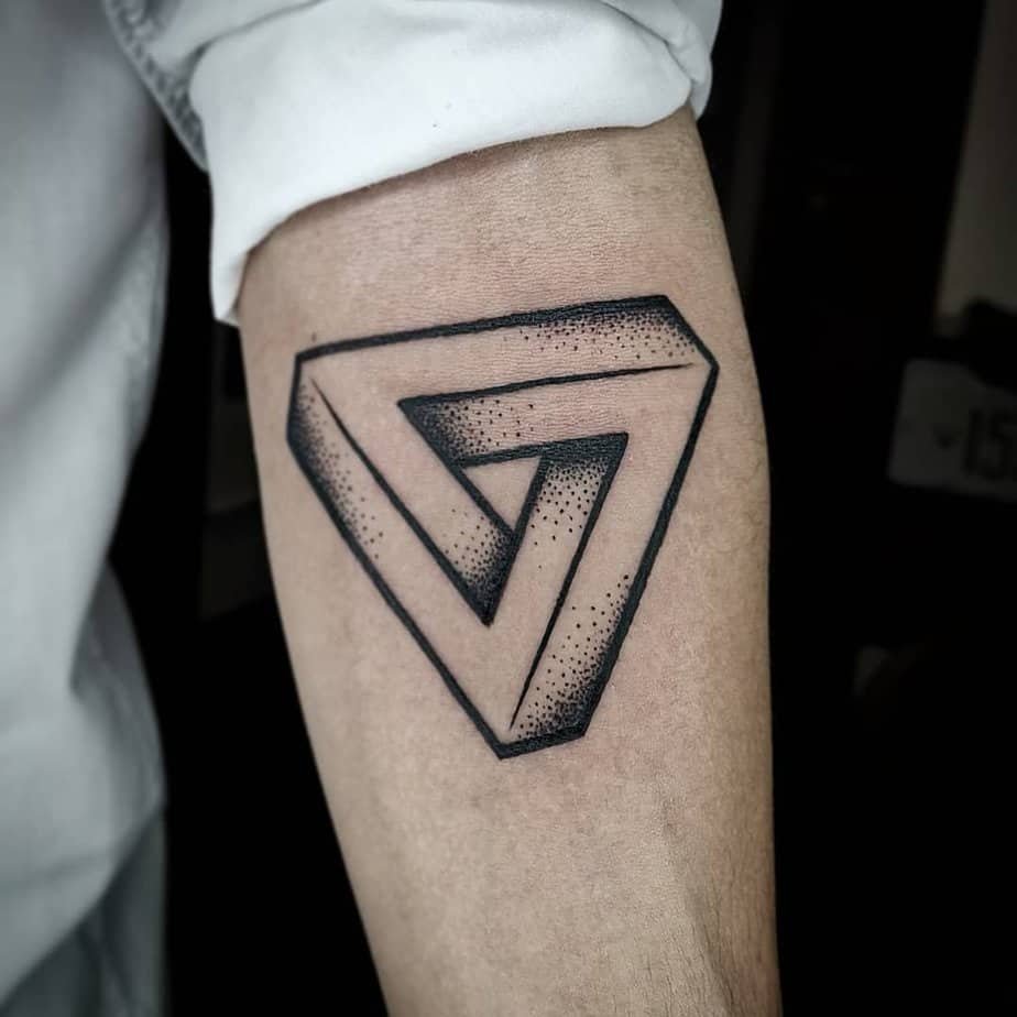 Stippled Penrose triangle on the forearm