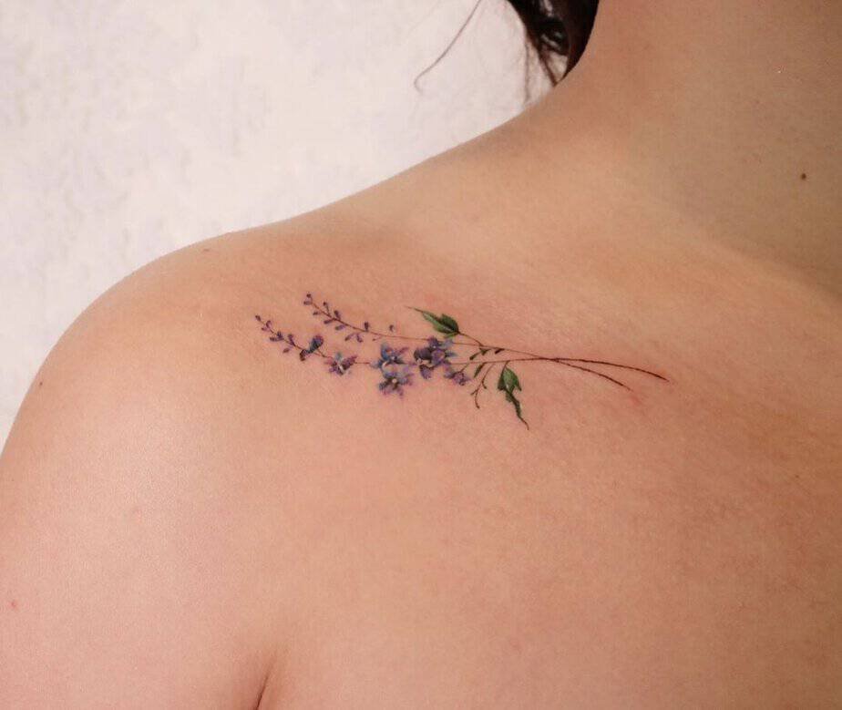 Subtle larkspur shoulder tattoo
