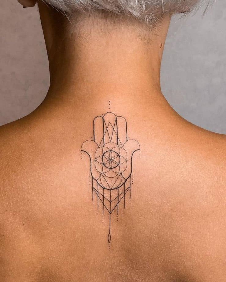 Geometric hamsa with mandala details
