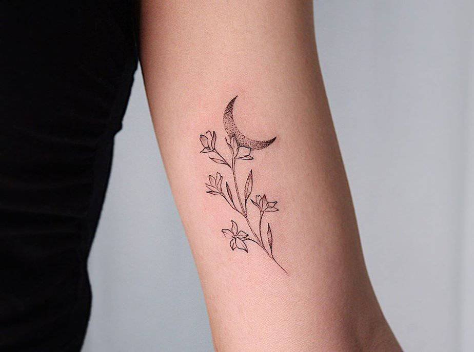 Larkspur and crescent moon tattoo