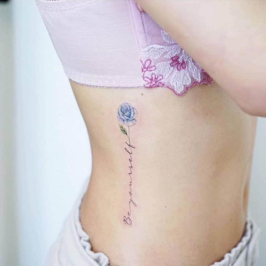 Delicate blue rose on the ribs with script stem