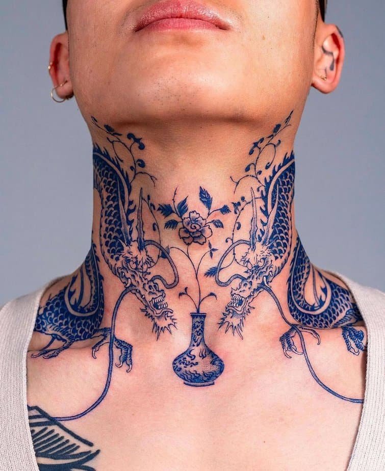 Bold blue ink neck and shoulder tattoo