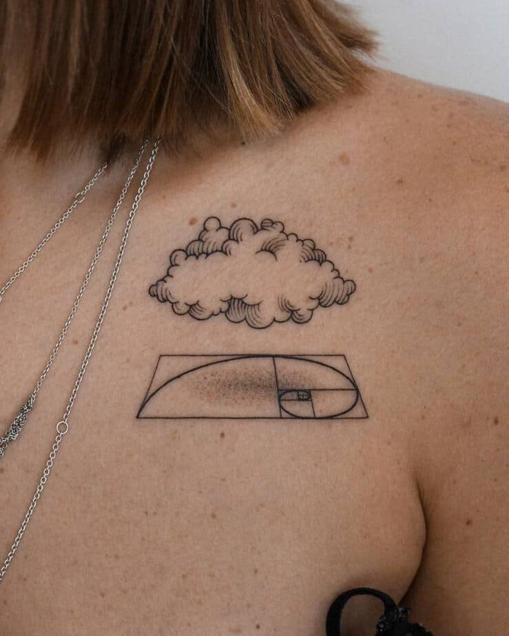 Cloud and golden spiral engraving tattoo