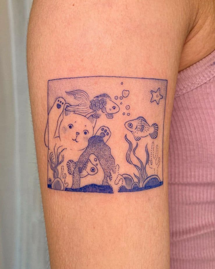 Cat and fish upper arm tattoo