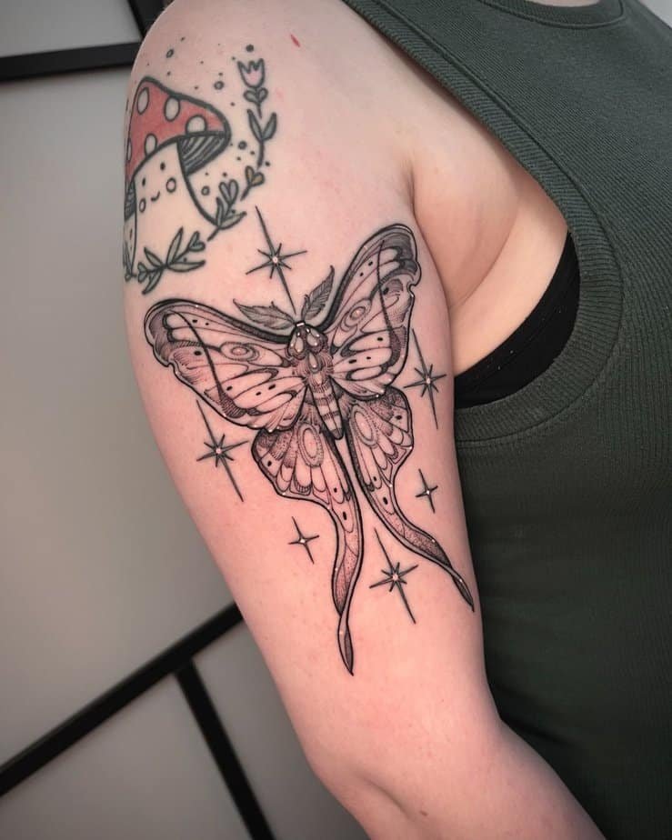 Delicate moth tattoo