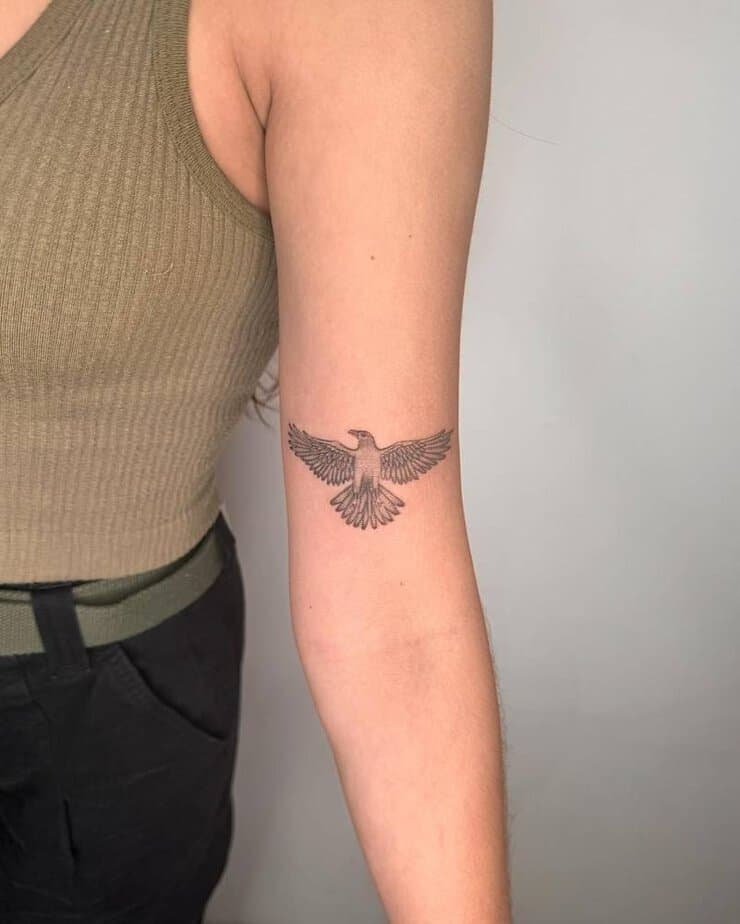 Eagle in flight on upper arm