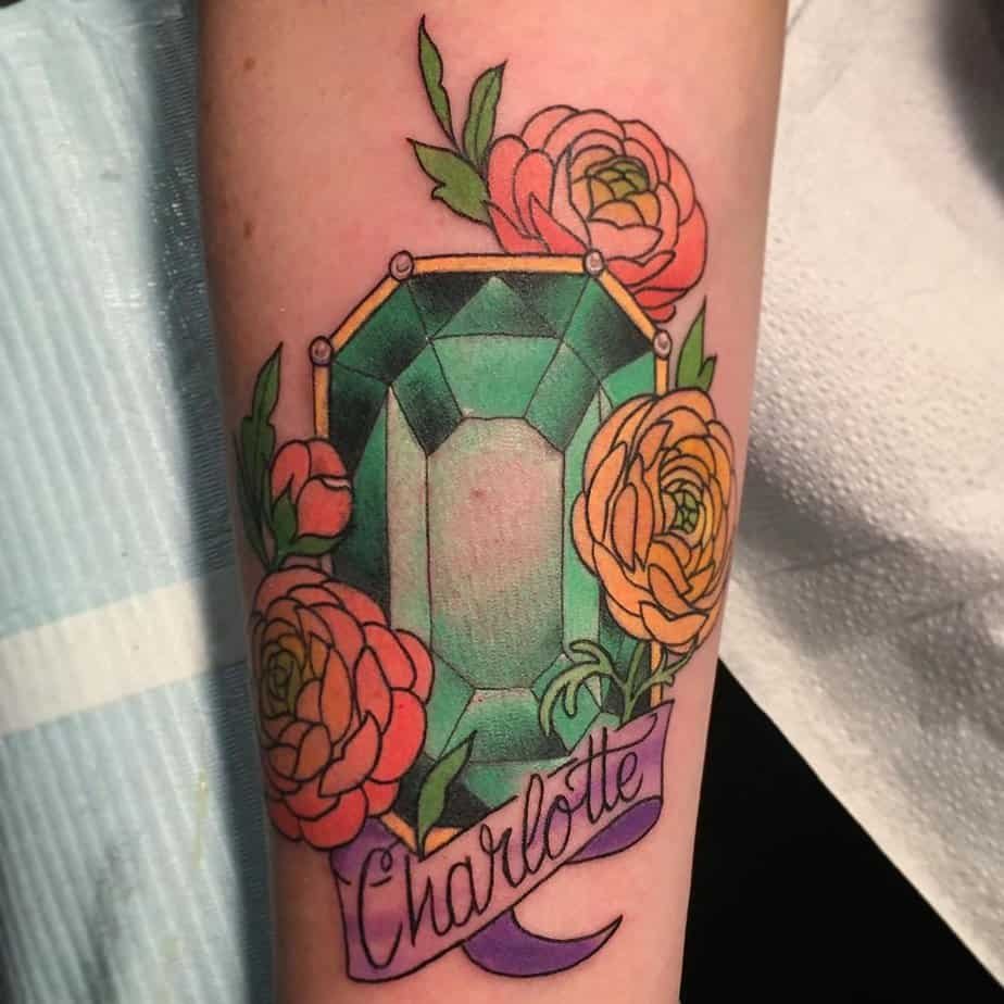 Emerald tattoo with lettering