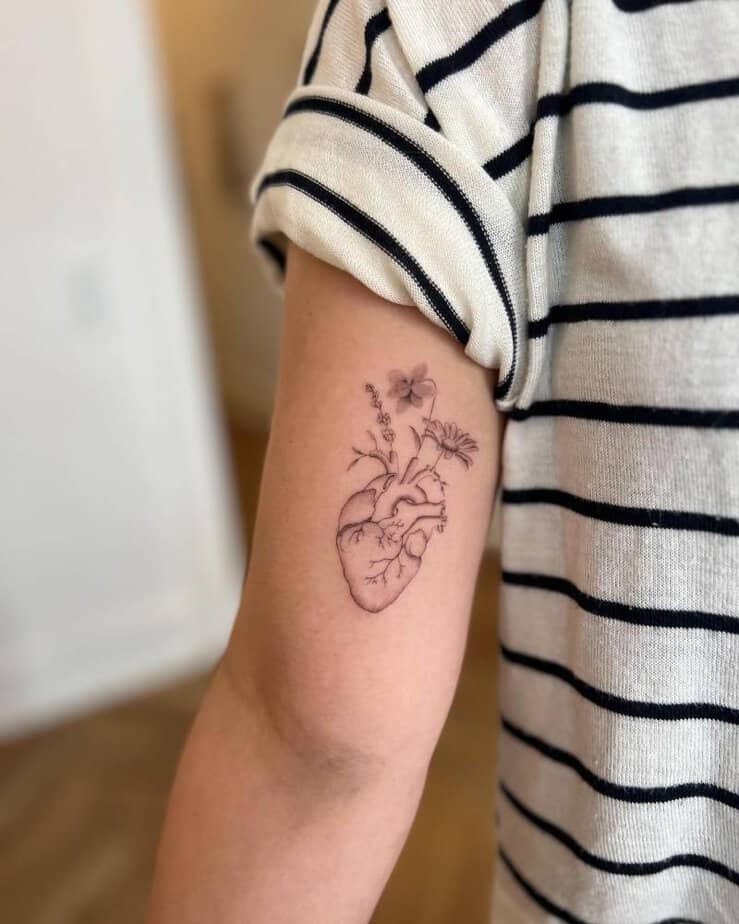 Human heart sprouting flowers