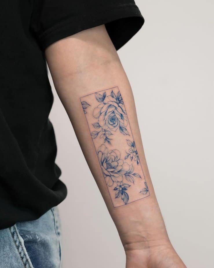 Flower frame forearm tattoo