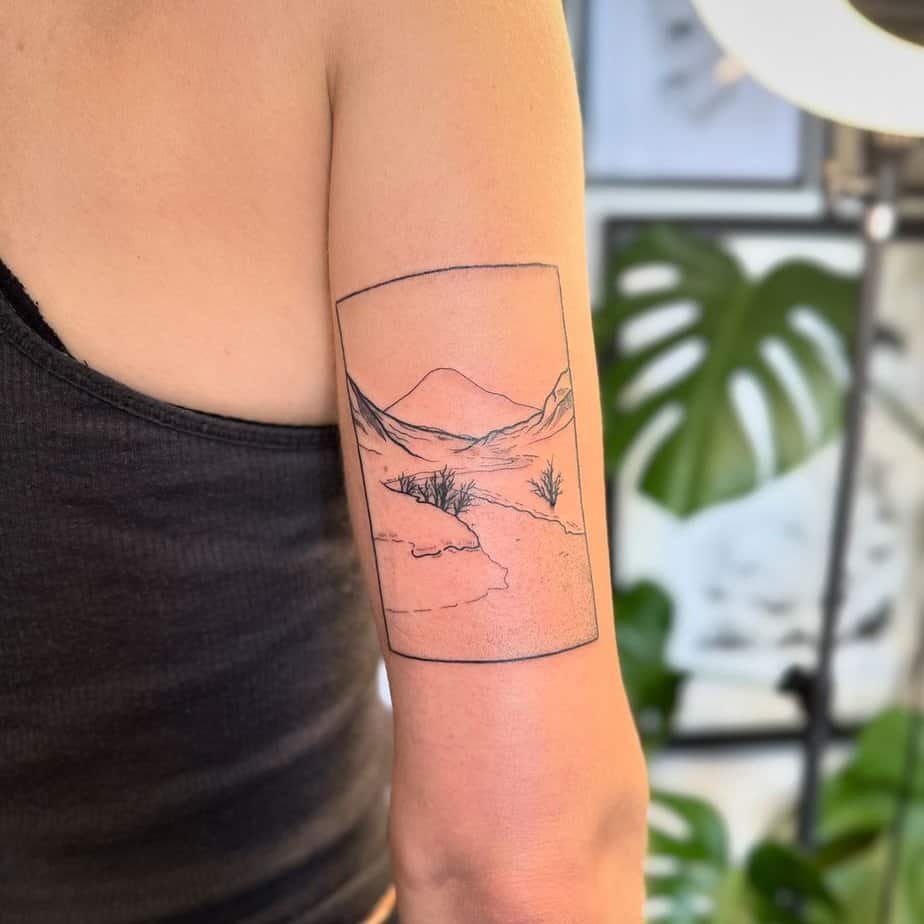 Framed Scottish scenery tattoo