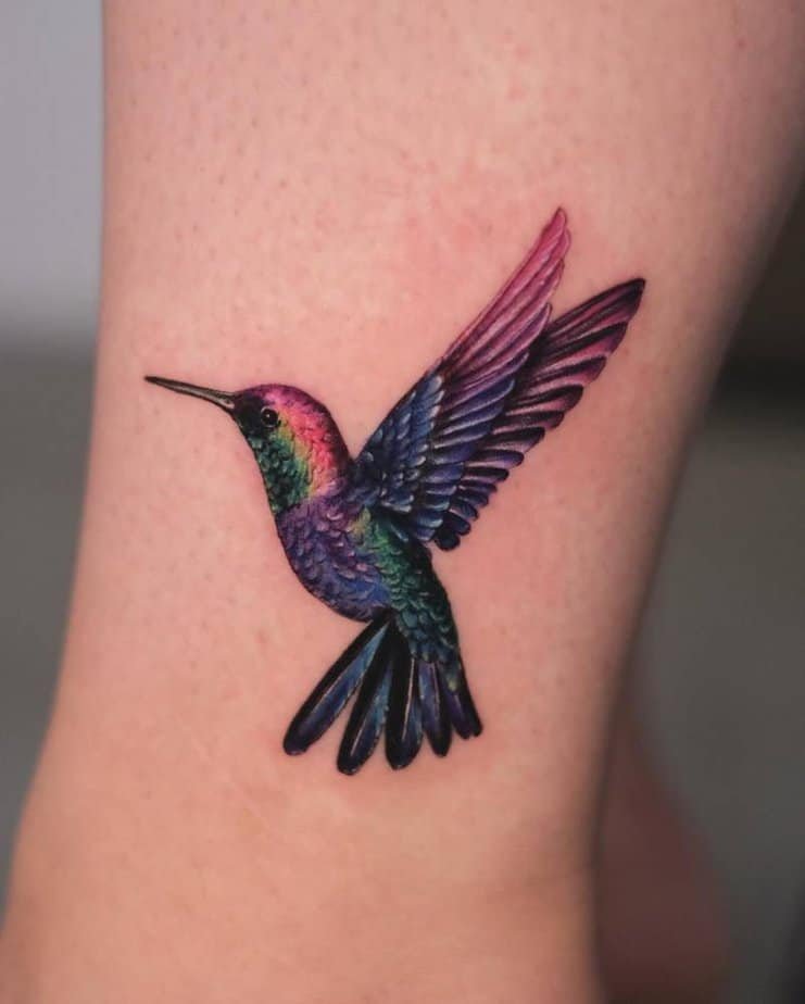 Vibrant hummingbird realistic tattoo