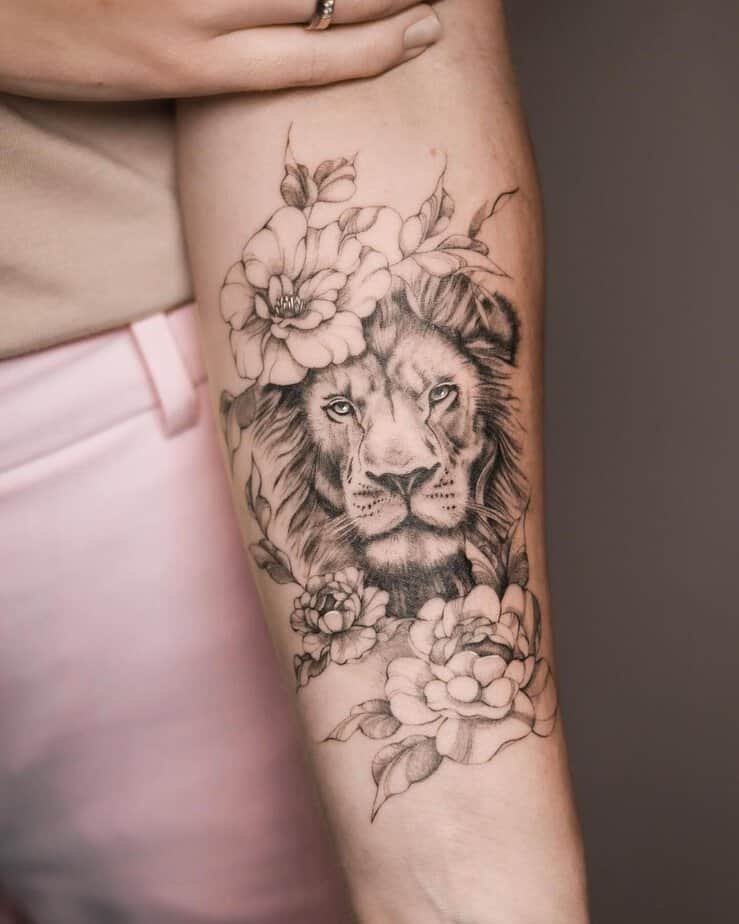 Lion energy forearm tattoo