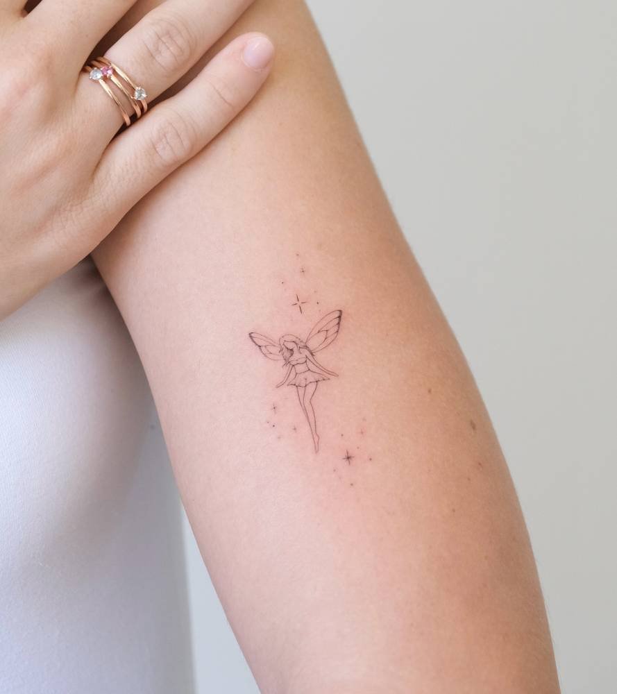 Delicate fairy on arm