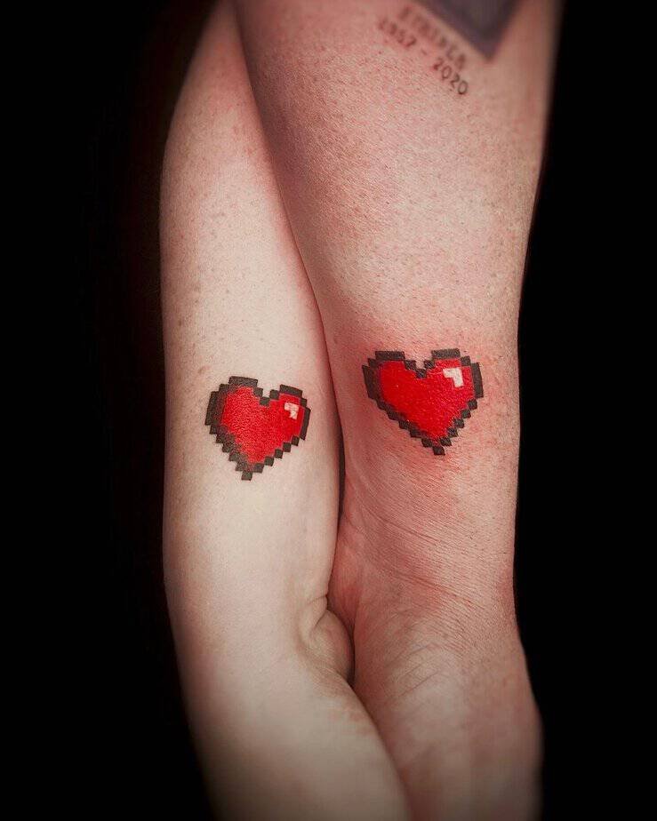 Matching pixel hearts tattoo