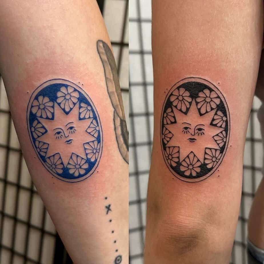 Matching blue ink and blackwork tattoos