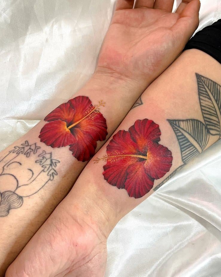 Matching hibiscus tattoos
