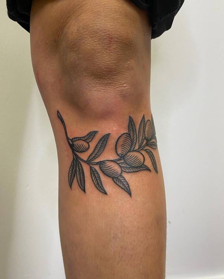 Olive branch engraving tattoo