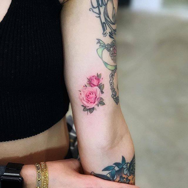 Two pink roses tattoo