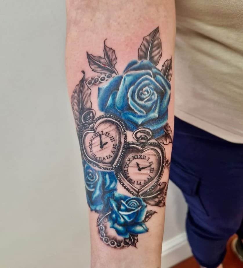 Heart-shaped pocket watches surrounded by blue roses