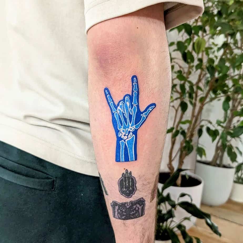 Skeleton hand I love you tattoo