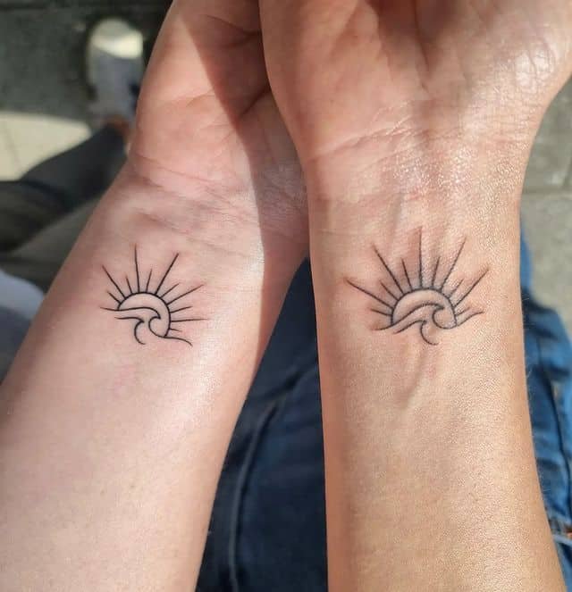 Sun and sea waves tattoo